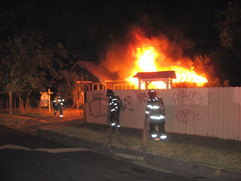 Firefighters approaching working fire
