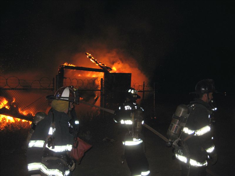 Firefighters approaching commercial fire